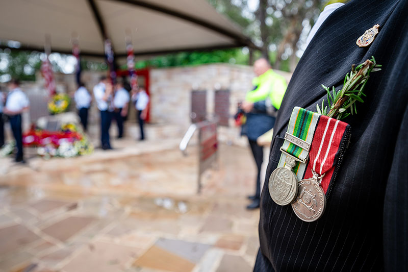 An RSL member attends a public ANZAC Day service