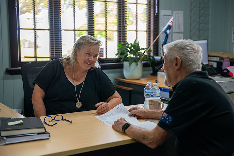 Veteran in RSL office, talking to a staff member