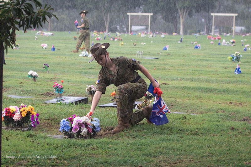 An Australian Army Cadet from 16 Army Cadet Unit Redcliffe lays a poppy and flag | Image by Cadet Under Officer Harry Anderson