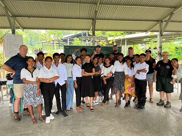 Major Guy Warnock and a group of people in Timor-Leste